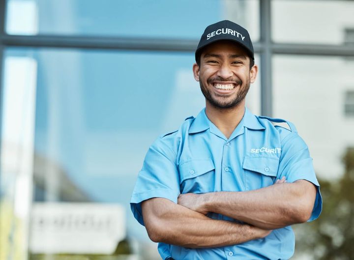 Smiling licensed security officer in uniform